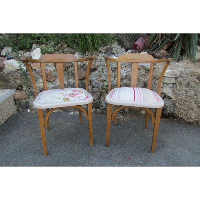 Chair with armrests in the taste of Baumann or Thonet, structure in beech, sanded, cleaned and waxed. Seat redone with...