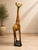 Bring warmth, artistry, and sculptural presence to your home with this impressive 60-inch hand-carved wooden giraffe...