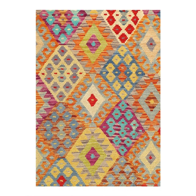Add a touch of elegance to your home with this casual chic hand woven Kilim wool rug. Constructed on a loom by Nomad...