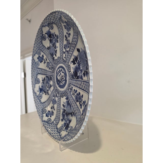 Lovely large porcelain plate. Stunning in person due to its size, heavier weight and scalloped edges.
