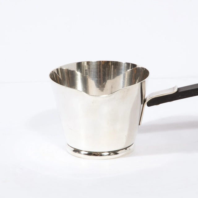 This beautifully designed hand wrought Modernist Sterling Silver Sauce Boat with Ebony Handle is made by Allan Adler and...