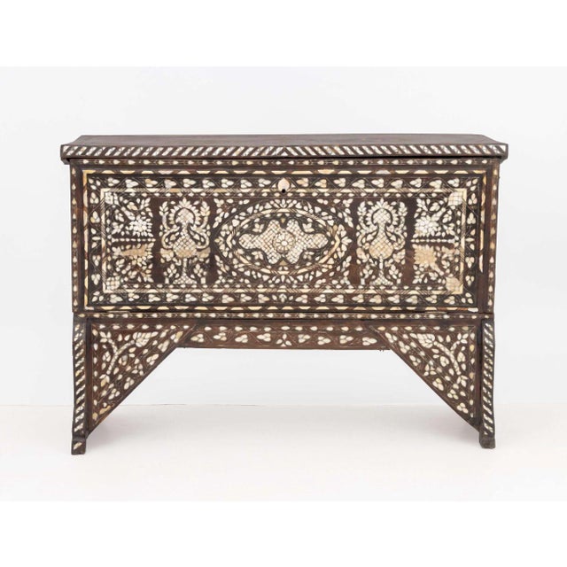 Syrian Mother-of-Pearl Shell Inlaid Cabinet, 19th century, the fall front door opening to a storage compartment. 40.75" H...