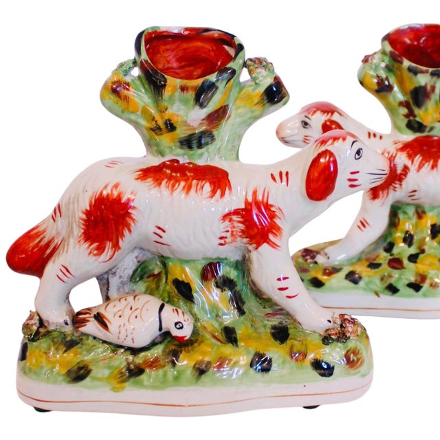 A charming pair of sauntering antique Staffordshire porcelain bird dogs. Spill vases were designed to hold wood match...