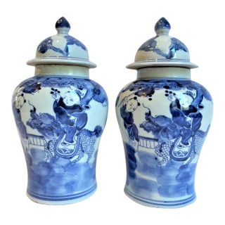 Chinoiserie Small Temple Jars With Children on Dragons - a Pair For Sale