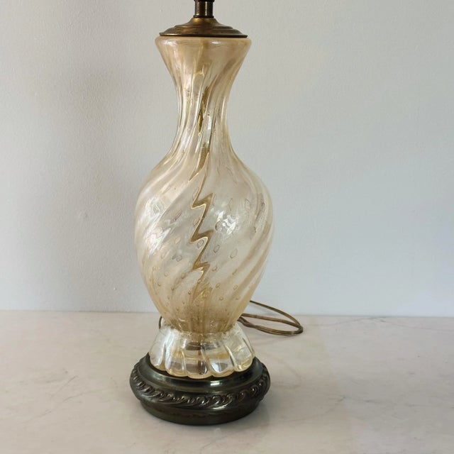Mid-Century Italian Murano Glass Lamp in Gold Swirl Measures approx: 32H (22 to socket), 7D Please visit my other listings...