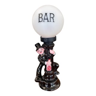 Mid 20th Century American Novelty Bar Lamp With Ceramic Drunk Man and Frosted Globe Shade For Sale