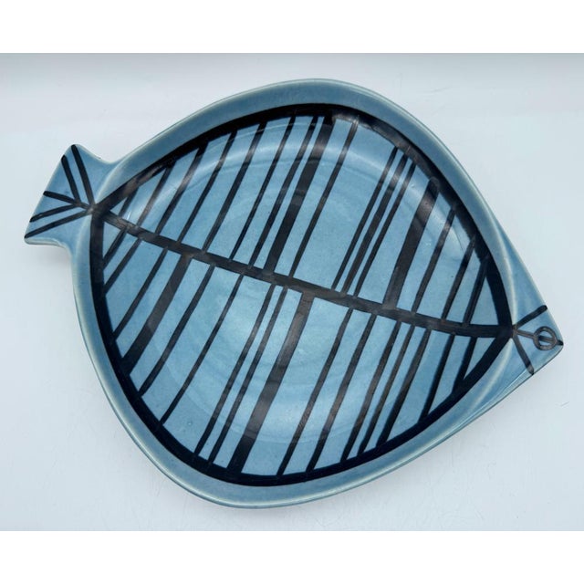 Two iconic Lisa Larson (1931-2024) Arita Ware fish ceramic 'STIM' (shoal) plates in glossy shades of blue and black...