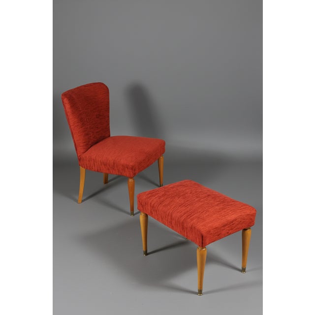 Small armchair with your footrest, 1960s. Fago wooden structure with brass tips in perfect condition. The fabric coating...