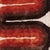 1970's wool pop-art style shag wall tapestry. The tapestry features a beige background and a wave design in black, brown,...