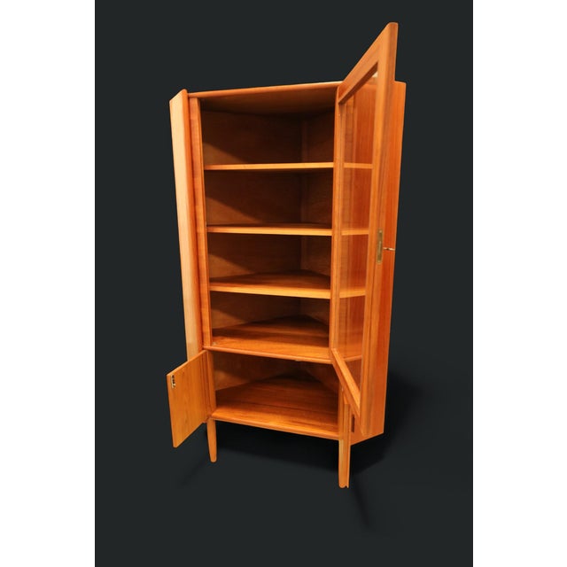 A fantastically beautiful corner cabinet/display cabinet designed by the designer gunni oman and manufactured by p. Rimmes...