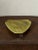 Mid century ceramic plate with pedestal foot. Triangular in shape and glazed in an avocado green.