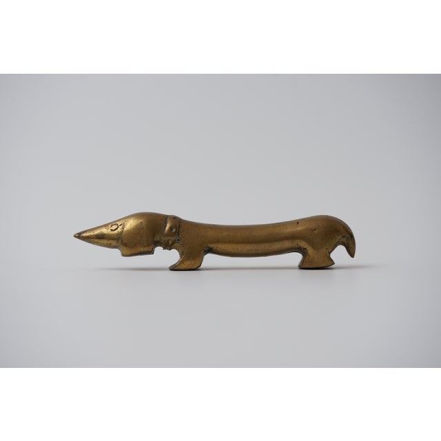 Object: Bottle opener in the shape of a dachshund Designer: Walter Bosse (1904–1979) Age: 1950s/1960s Material: Brass...