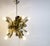 Unique chromed and brass chandelier from the space age area. The chandelier is made of chromed and brass bent metal...
