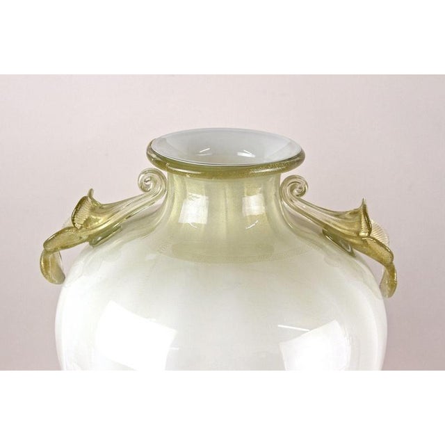 Impressive beige/ golden Murano glass amphora vase handcrafted by the famous company of Gabbiani Venezia. This...