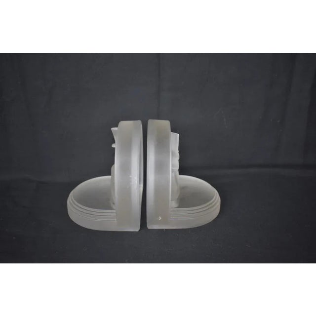 Stunning pair of Art Deco bookends. Designed by Edwin Fuerst. Made by Owens Illinois Glass Company in 1936. Frosted satin...