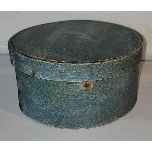 This early original blue painted panty box from New England has early hand made nails. The condition is very good and...