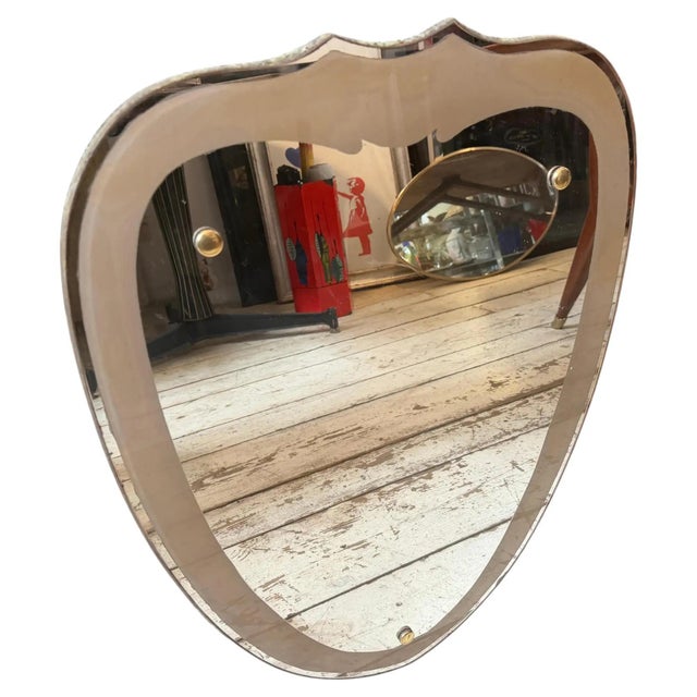 This exceptional 1950s Italian wall mirror embodies the organic elegance and refined craftsmanship characteristic of mid-...
