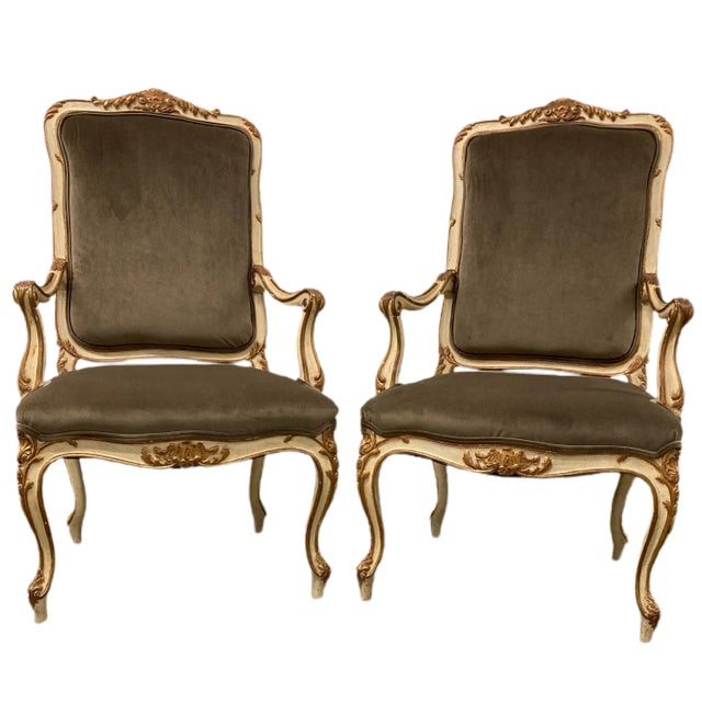 Handsome Pair of Arm Chairs. Original finish is antique off white with gold leaf detail. Beautiful patina. Chocolate Brown...