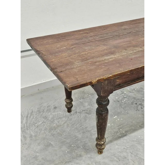 In this listing you will find a spectacular Antique Farmers Table. Table is done in solid pine, over 1 inch thick and it...
