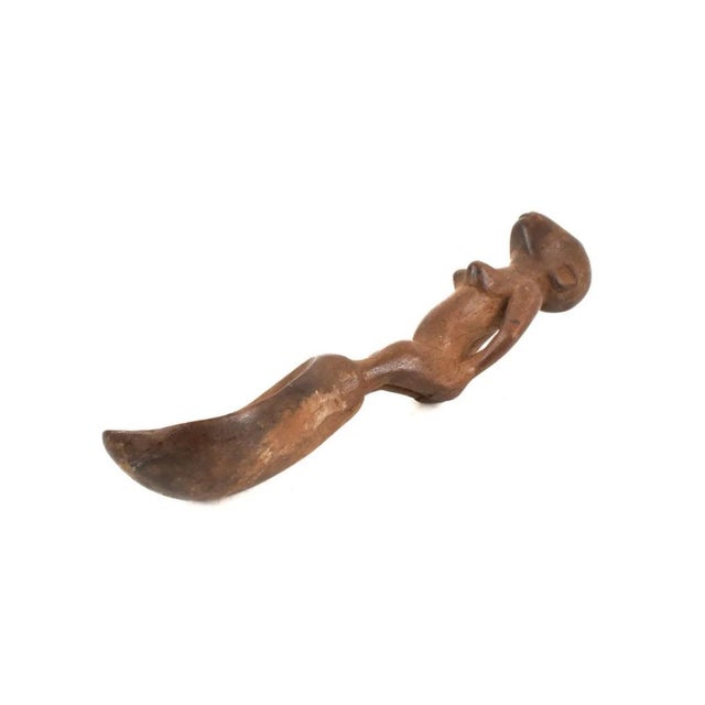 The Nyamwezi Mwana Hiti Spoon hails from Tanzania, showcasing remarkable craftsmanship and cultural significance. Carved...