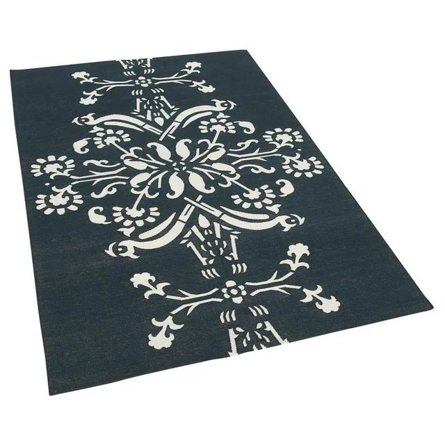 Add a touch of timeless elegance to your home with our cotton dhurrie kilim rug. Expertly flat-woven from durable cotton,...