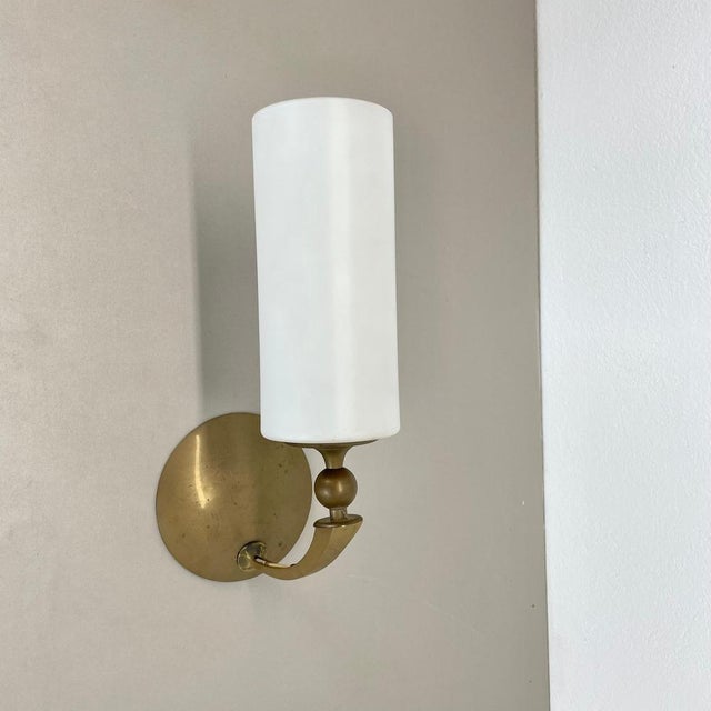 Article: Brass wall light Producer: Origin France Age: 1950s This modernist wall light was produced in France in the...