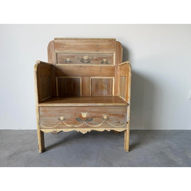 Charming antique hand-painted wooden settle bench crafted in the traditional European folk art style. Constructed from...