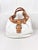 Embrace mid-2000s style with this authentic Coach Soho Lynn Hobo Bag (Style F15075). A beautiful study in contrasting...