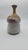 beautiful vase with tall neck. Great glaze, with a impacted or squeezed experimentation method after being thrown on...
