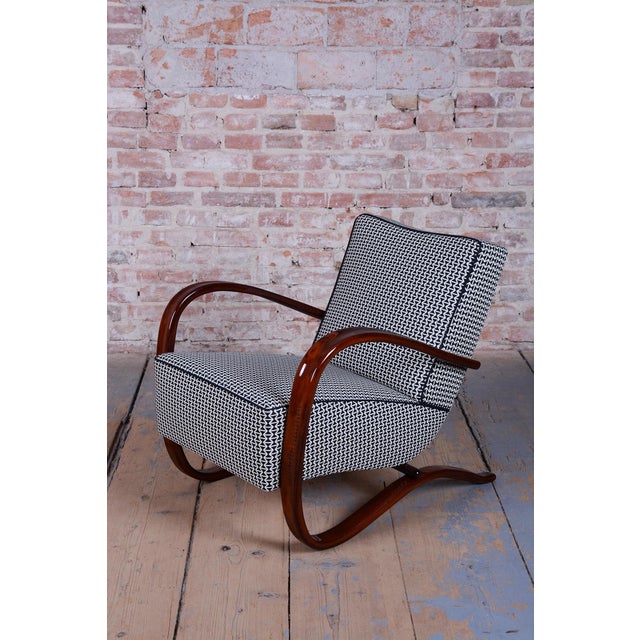 Model: h-269 conceived in the spirit of interwar art deco, this exceptionally iconic and dynamically shaped armchair...