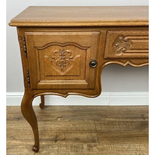 A beautifully crafted Vintage French Louis sideboard showcasing elegant curves and finely carved detailing, perfect for...
