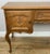 A beautifully crafted Vintage French Louis sideboard showcasing elegant curves and finely carved detailing, perfect for...