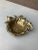 A wonderfully decorative vintage cast brass catchall with a layered hunting composition of horn, pistols, oak leaves, and...