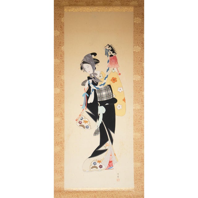 Beautiful Japanese silk scroll painting depicts a Young Beauty with a Puppet by Getsudo. Signed and sealed by the artist:...