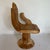 A Buddha or hand chair .The chair is in a carved wood. The chair is a literal representation of the Asana pose in Buddhism...