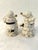 Charming vintage ceramic salt and pepper shakers in a figural Santa motif adorned with delicate holly berries and gold...