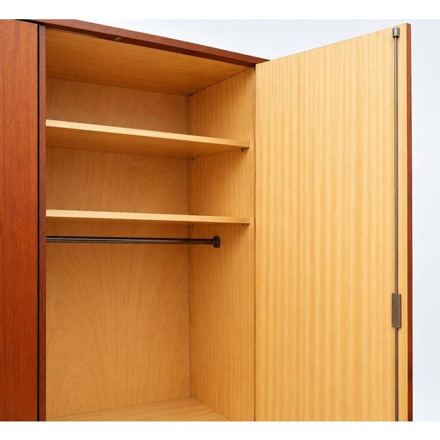 Vintage mid-century four-door wardrobe from the 1960s. This spacious vintage wardrobe features a clean, understated design...