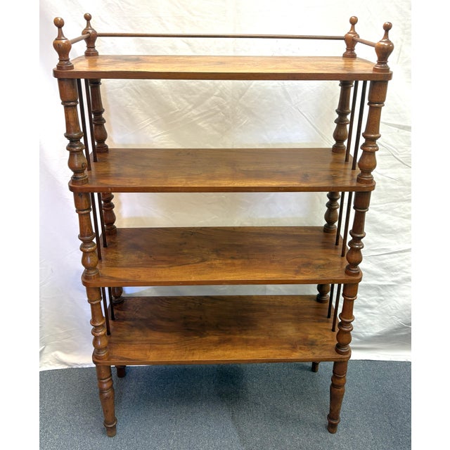 Early 1900's antique wood étagère. It has a Victorian and American Colonial style with its vertical spindles and top...