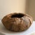 Offering a dramatic mid-20th Century Palm Beach Regency rattan basket bowl with hand-stitched banana leaf exterior. This...