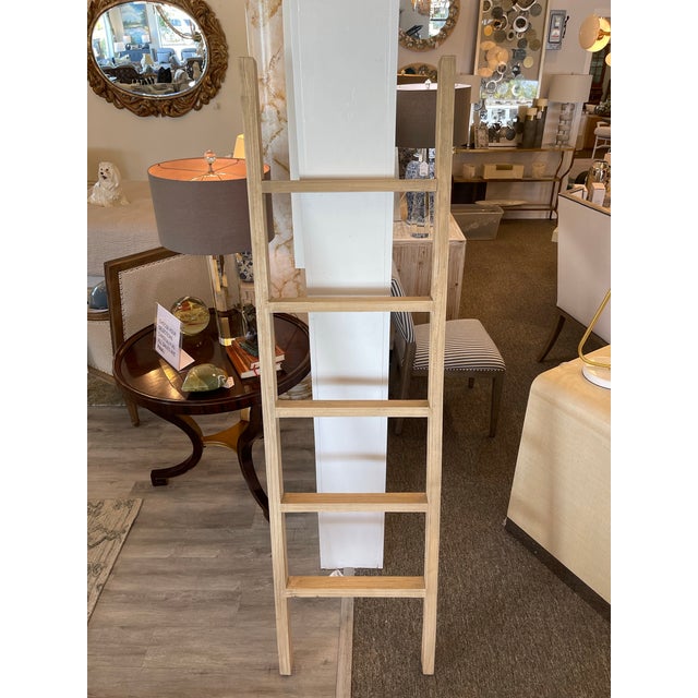 Add a touch of vintage elegance to your home with this beautifully crafted light wood ladder. Featuring an antique finish,...