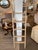 Add a touch of vintage elegance to your home with this beautifully crafted light wood ladder. Featuring an antique finish,...