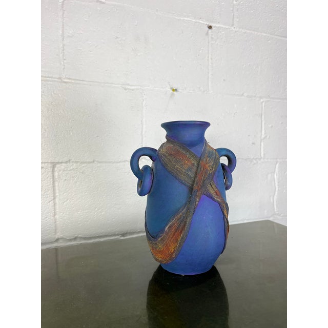 Sculptural studio art pottery vase featuring a dramatic amphora form with four loop handles and richly textured crossed...