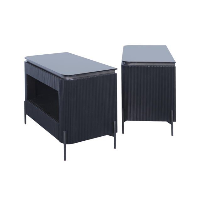 A pair of Iris nightstands made by Universal for their Nina Magon Collection. Open shelf cabinets with upper and lower...