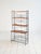 Iron frame with adjustable teak shelves and a lower magazine rack. 1960s freestanding bookcase. This 1960s freestanding...