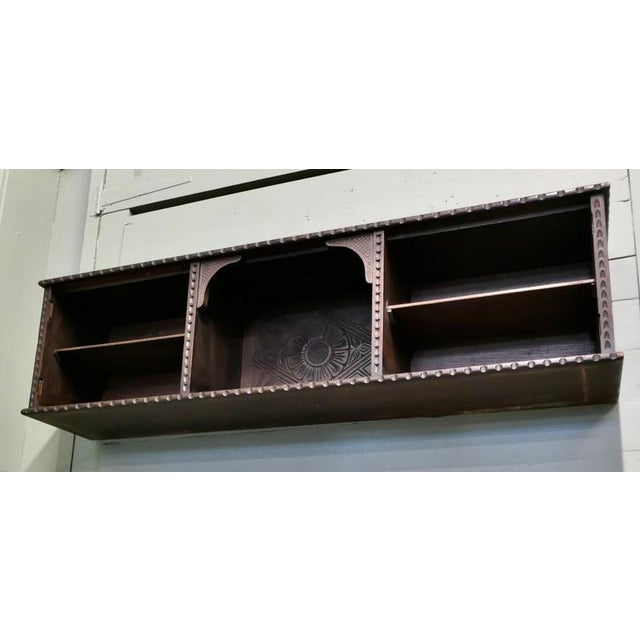 Long Gothic Carved Oak Wall Shelf with storage This charming long shelf has a geometric carved panel at the back of the...