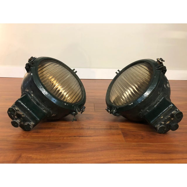 Pair of dark green, heavy duty ship's spotlights or search lights. They still have their mounting and adjusting hardware...