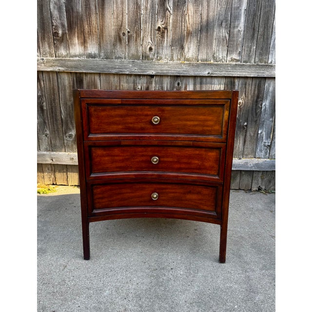 Fine mahogany serpentine-front three-drawer chest in English Regency manner. Features dovetailed drawer construction,...