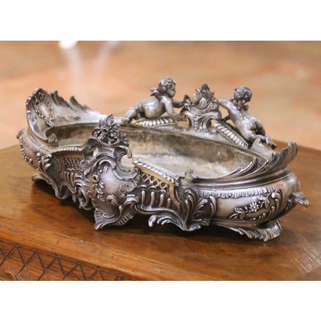 Bring elegant French style to a dining table, mantel, or center island with this richly sculpted antique jardinière....