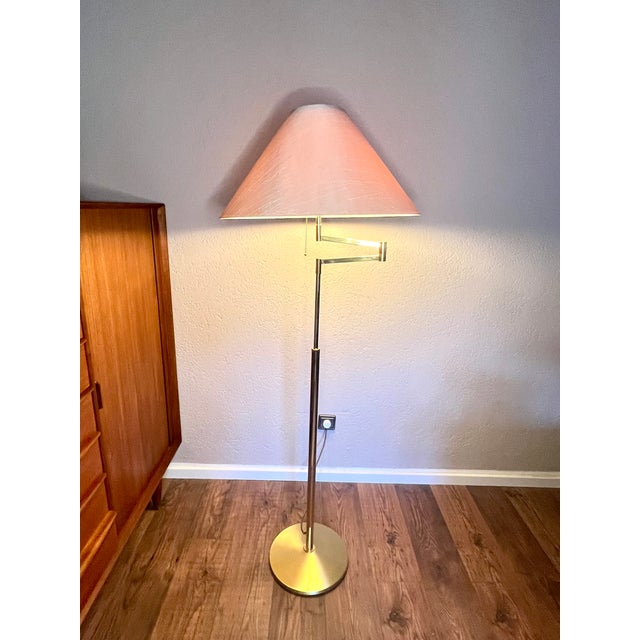 Mid-Century Modern Brass Floor Lamp with Swivel Arm from Gebrüder Knappstein Leuchten, 1960s This floor lamp is a true...