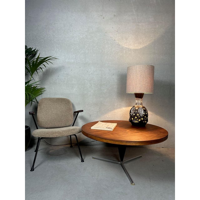 Early edition of Verner Panton's "cone coffee table." Chrome tripod with a conical column. Wooden top with rosewood...